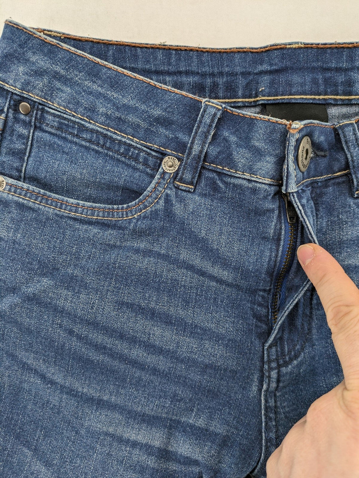 Best Connections blue skinny jeans with frayed hem and sporty side stripe.