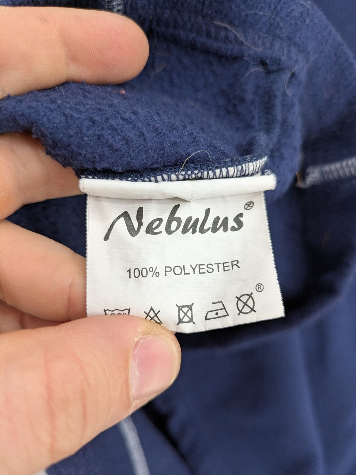 Nebulus navy turtle neck jumper with graphic print collar and "Himalaya Expedition" patch.