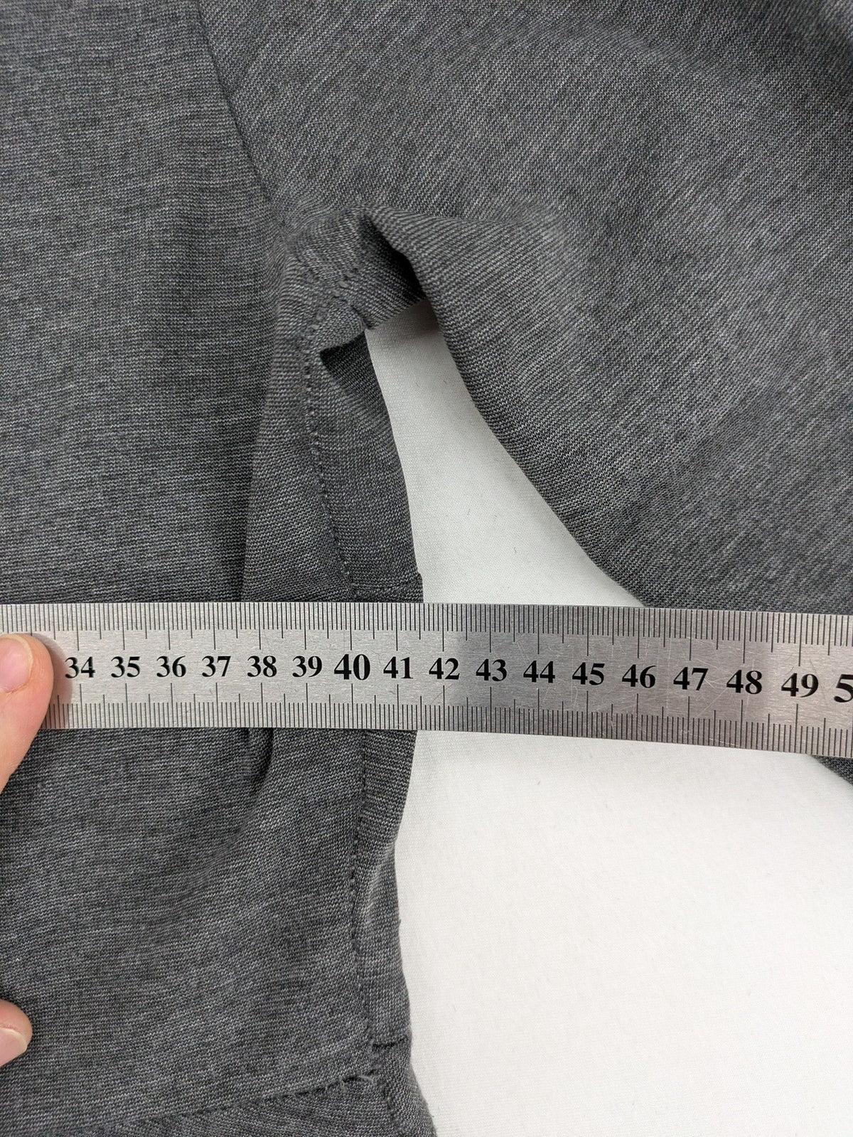 Ginatricot grey A-line skater dress with 3/4 sleeves and visible back zipper.