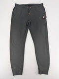 Kuyruun black jogging pants with kangaroo logo, elastic waistband, and ribbed cuffs.