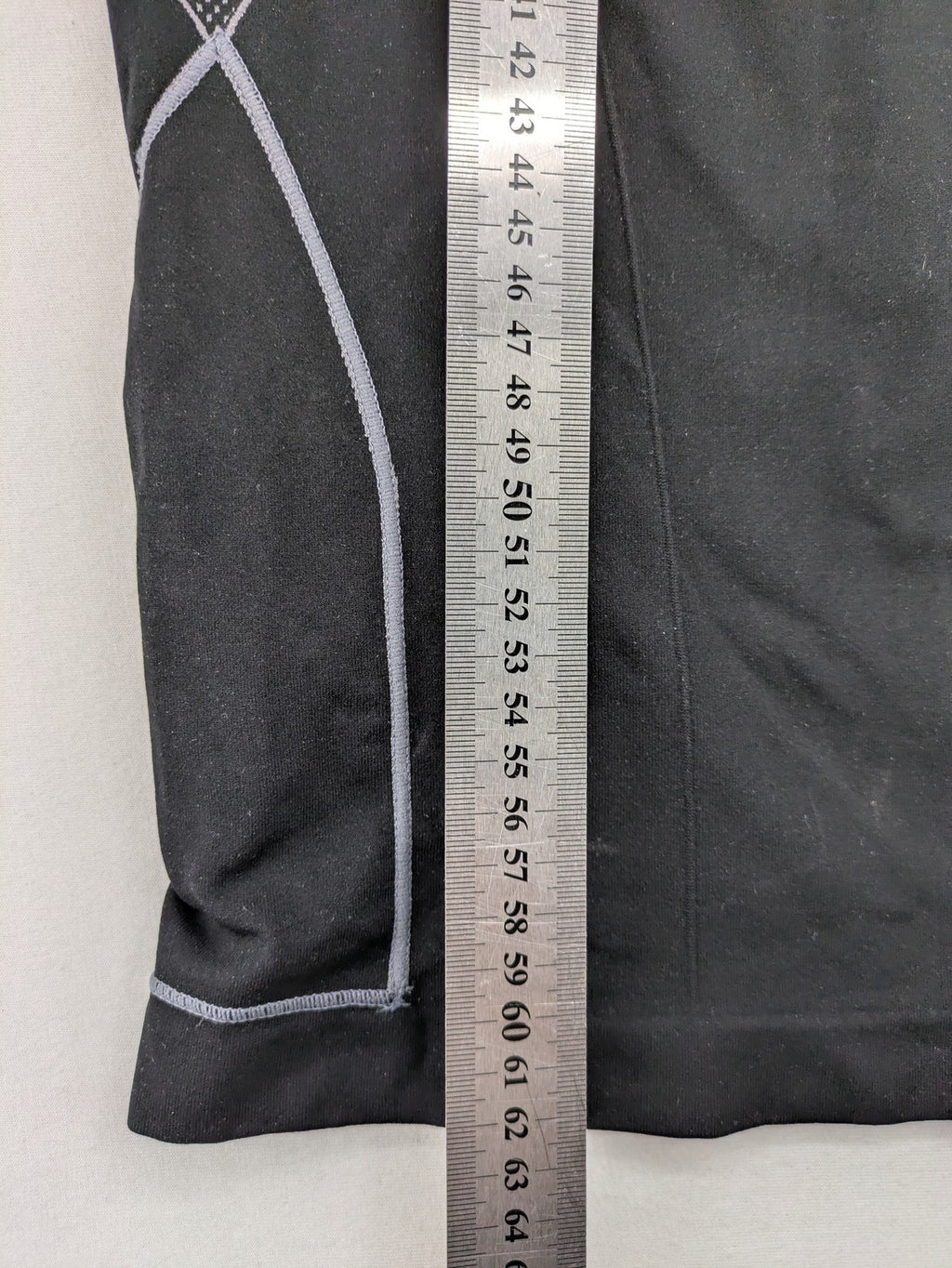 Iron-ic black long sleeve baselayer top with standing collar and thumbholes.