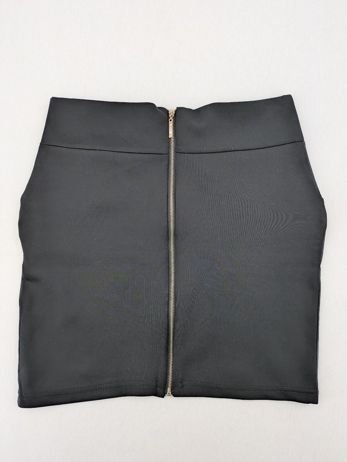 Romatie black mini bodycon skirt satin finish high waist with gold zippers and buckles.
