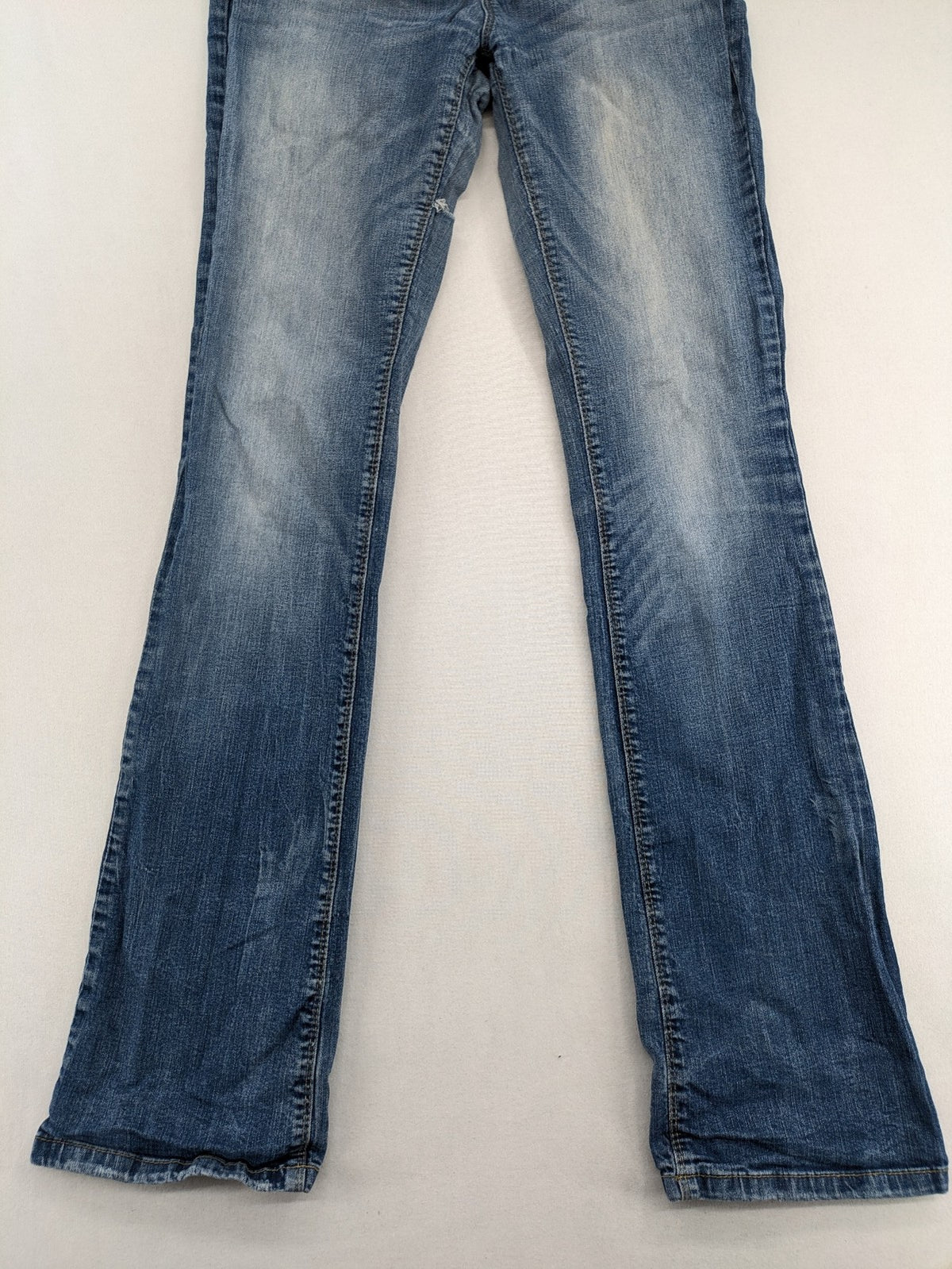 C&A blue bootcut jeans with faded denim and low rise fit, made from cotton blend.