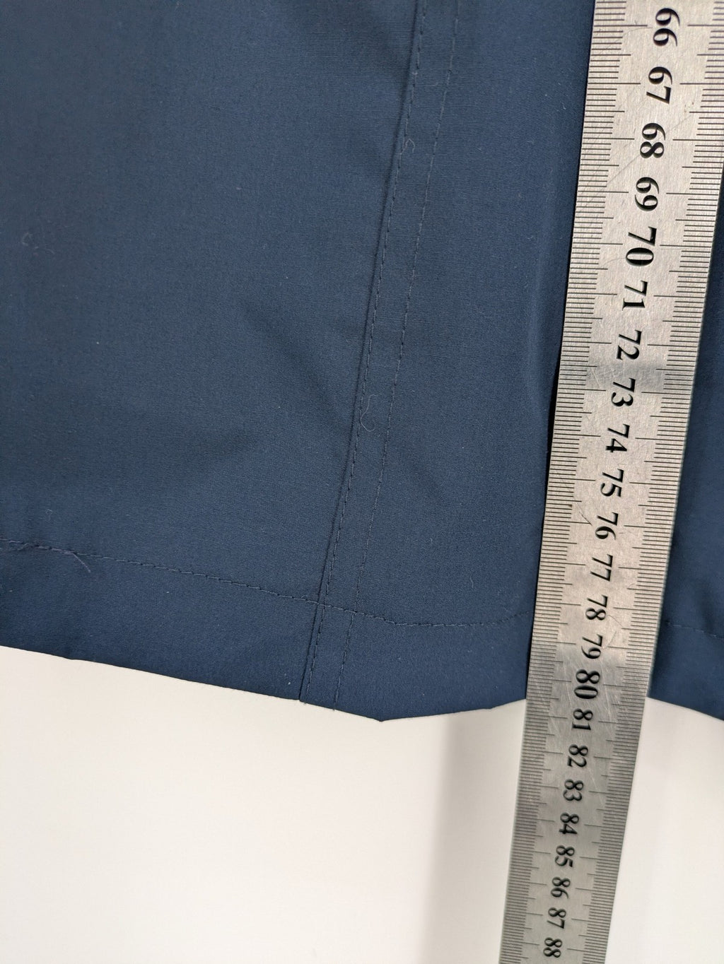 everYou navy parka jacket with hood, adjustable drawstring, patterned lining, button closure.