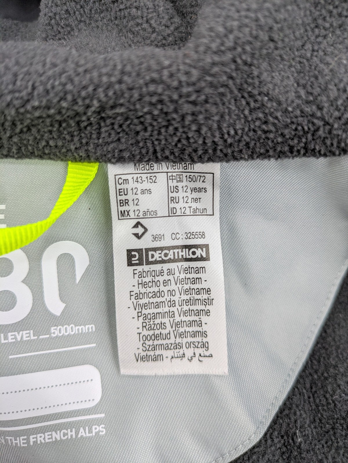 Wedze ski coat grey and black colorblock design with neon accents and fleece lining.