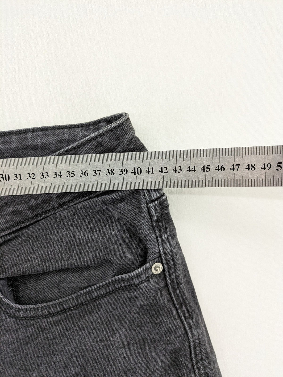 Zara black straight jeans faded wash five-pocket design with zipper closure.
