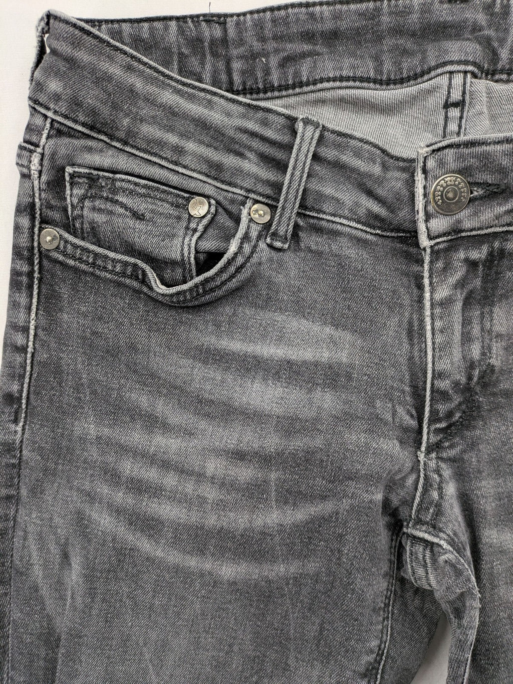 H&M grey skinny jeans with low rise, classic 5-pocket style, and washed denim finish.
