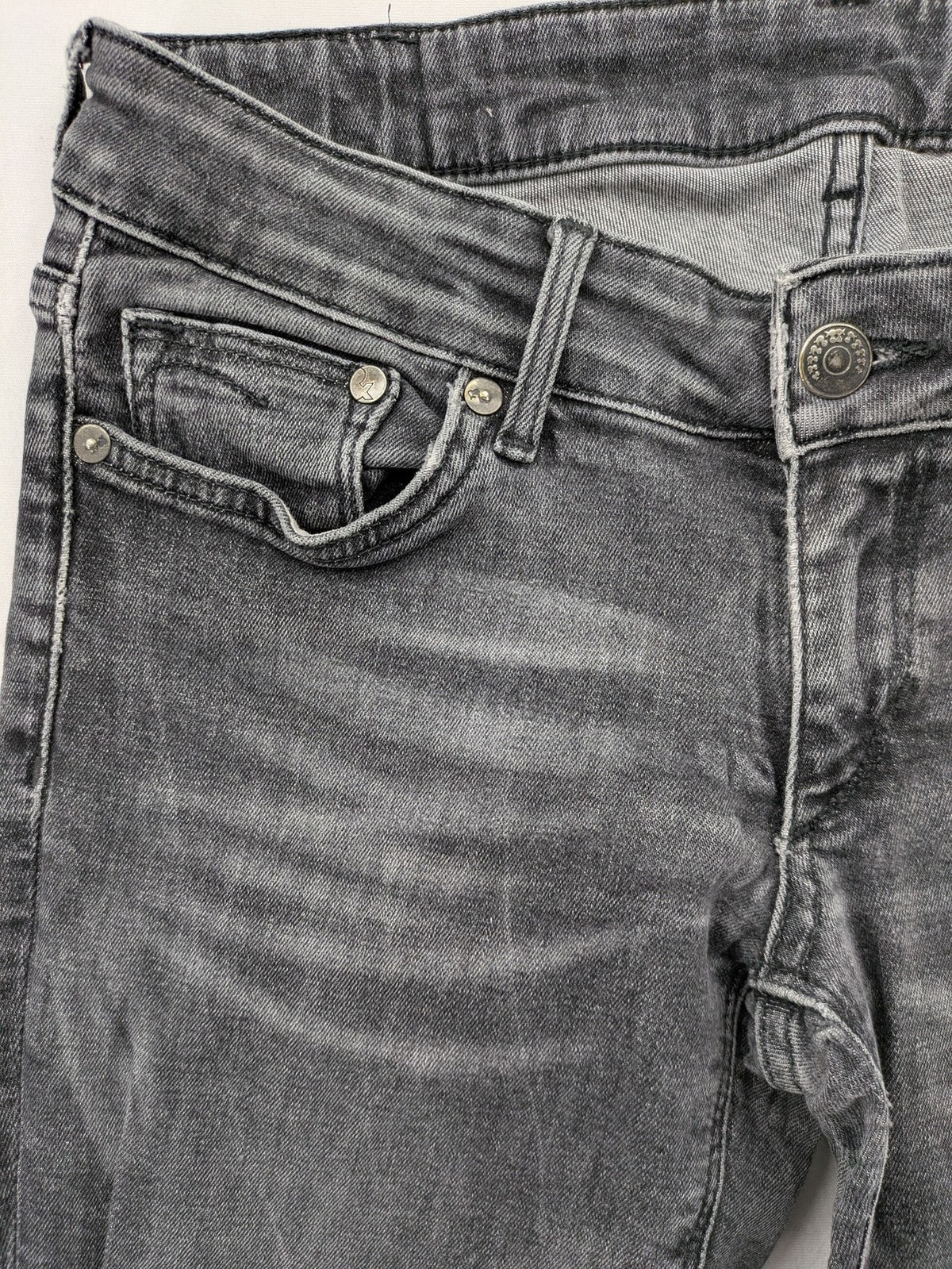 H&M grey skinny jeans with low rise, classic 5-pocket style, and washed denim finish.