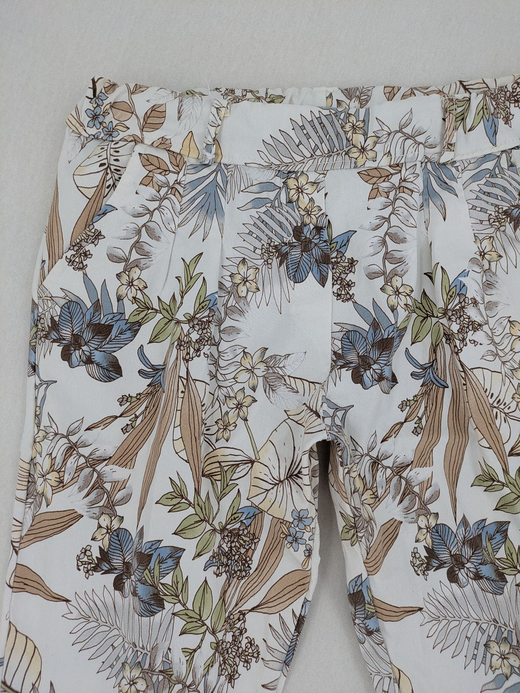 Made in Italy multi pants tropical floral pattern cotton-viscose blend on white background.