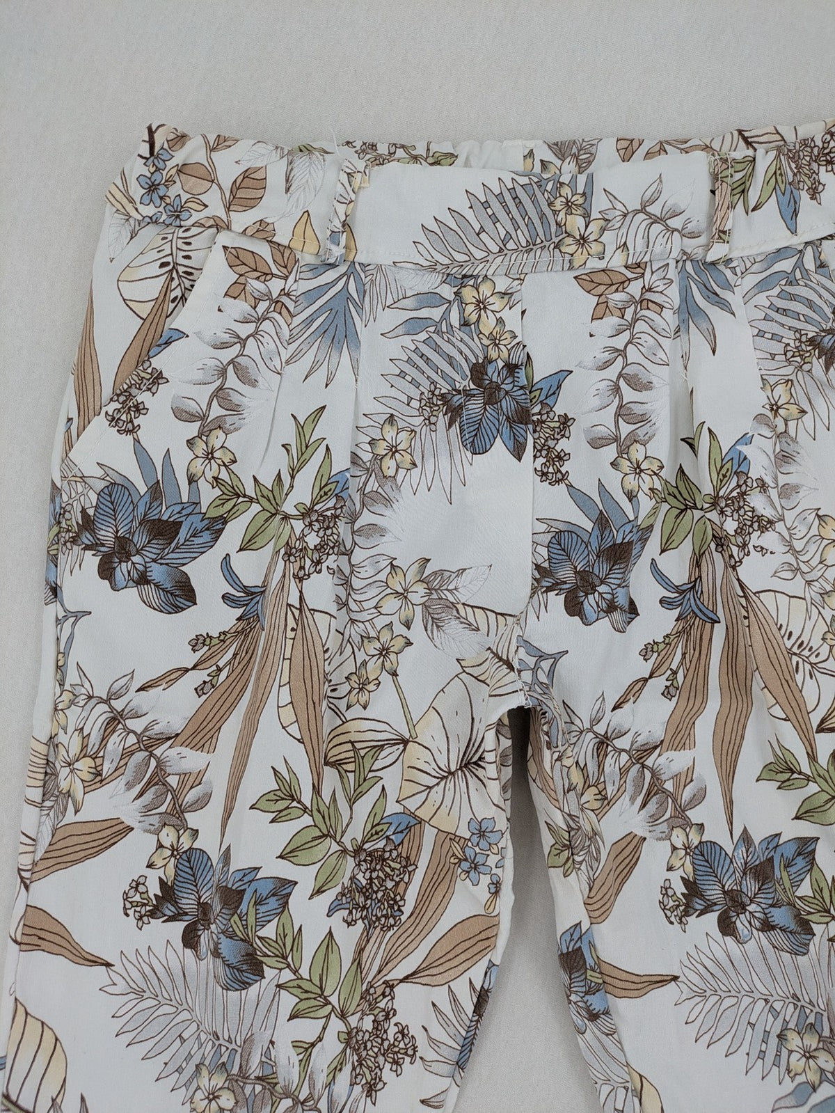 Made in Italy multi pants tropical floral pattern cotton-viscose blend on white background.