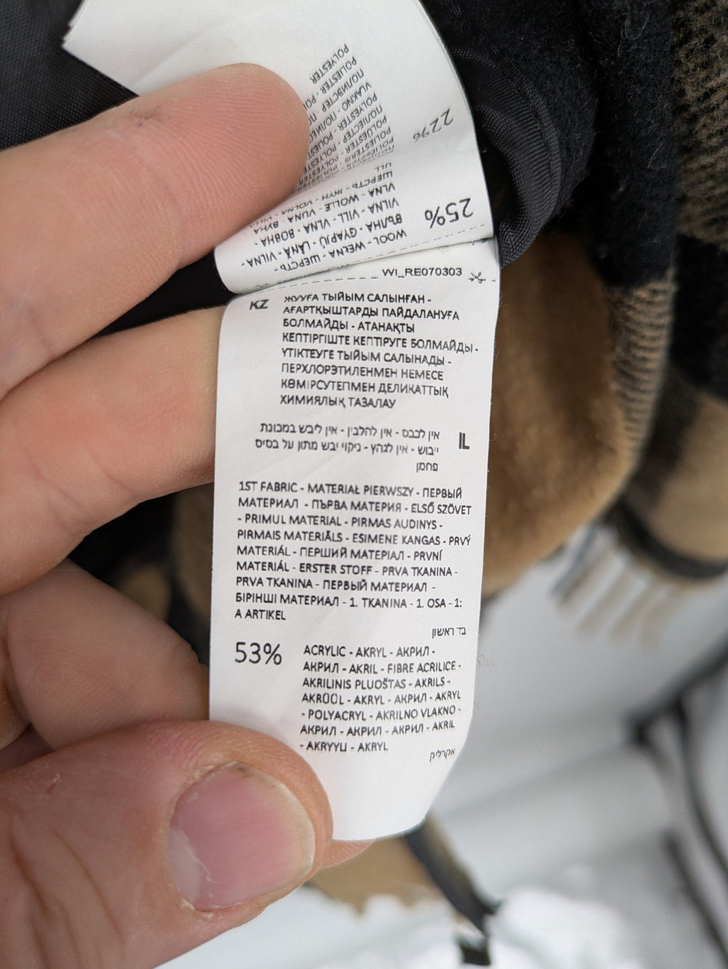 Reserved cream coat with brown and black check pattern, fringe hem, wool blend material.