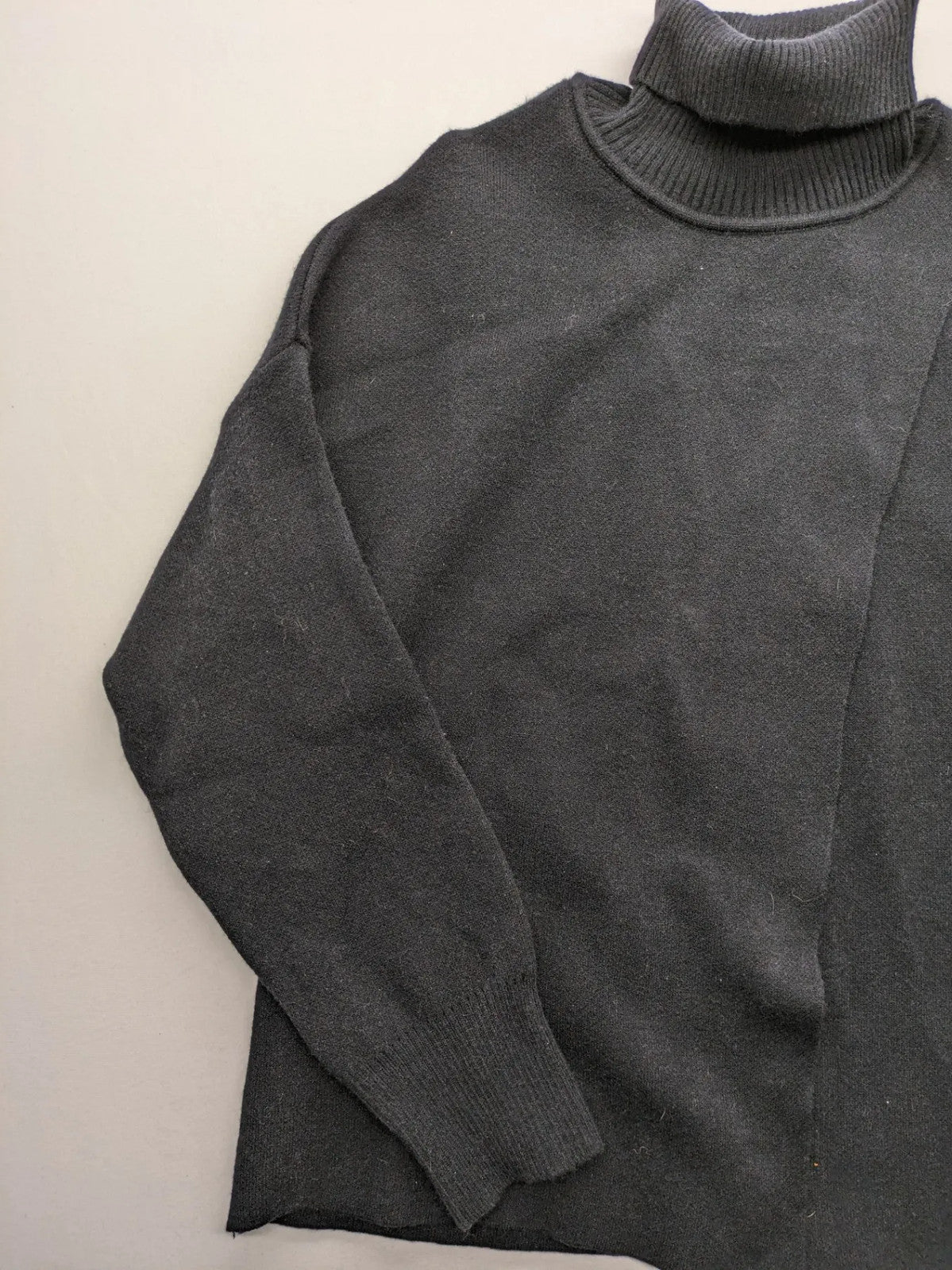 In Shape grey turtle neck jumper asymmetrical design, soft viscose blend material.