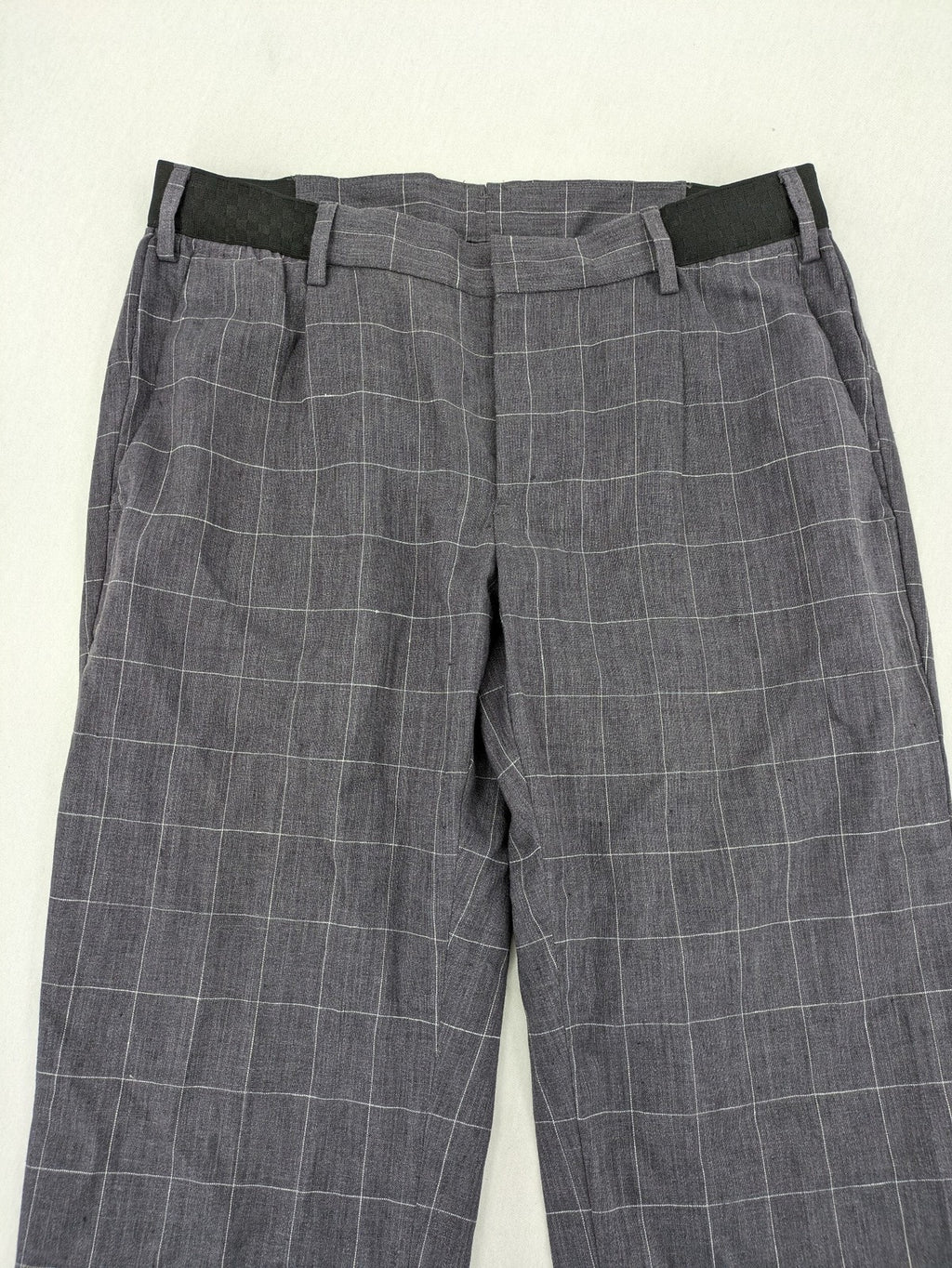 MNG Man grey plaid pants with rolled hem and stretch performance material.