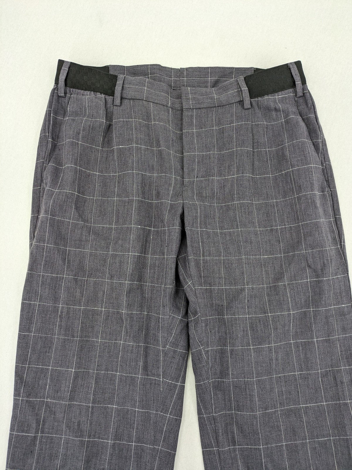 MNG Man grey plaid pants with rolled hem and stretch performance material.