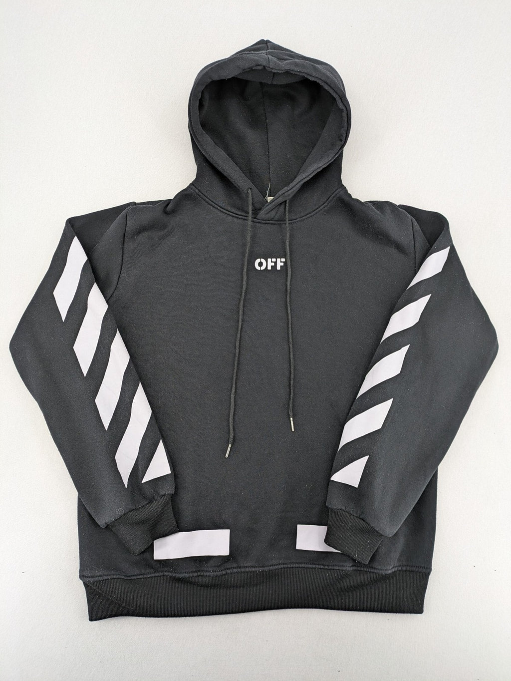Off-White white zip-through hoodie with diagonal stripes and large arrows graphic.