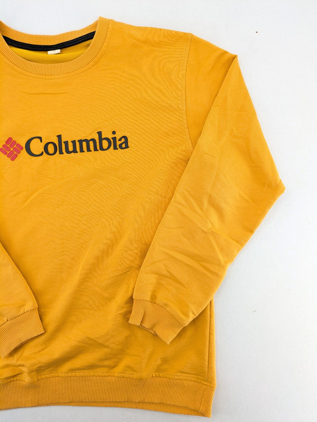 Columbia yellow turtle neck jumper with iconic logo, ribbed cuffs, and soft cotton material.