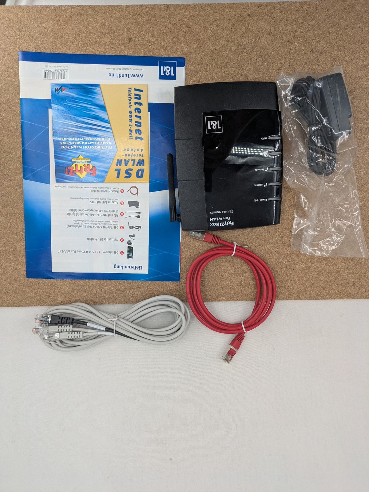 AVM VoIP gateway router blue with integrated DSL modem and phone system features.