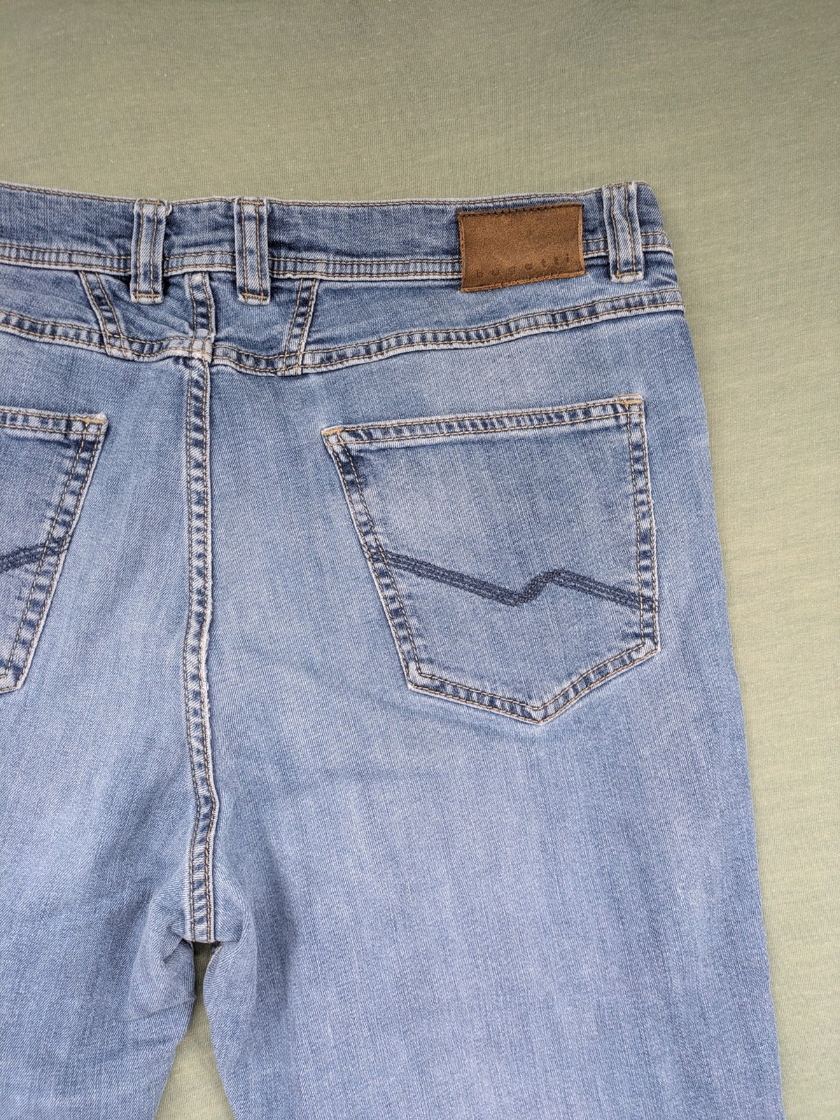 Bugatti blue straight jeans with classic 5-pocket design and light wash denim.