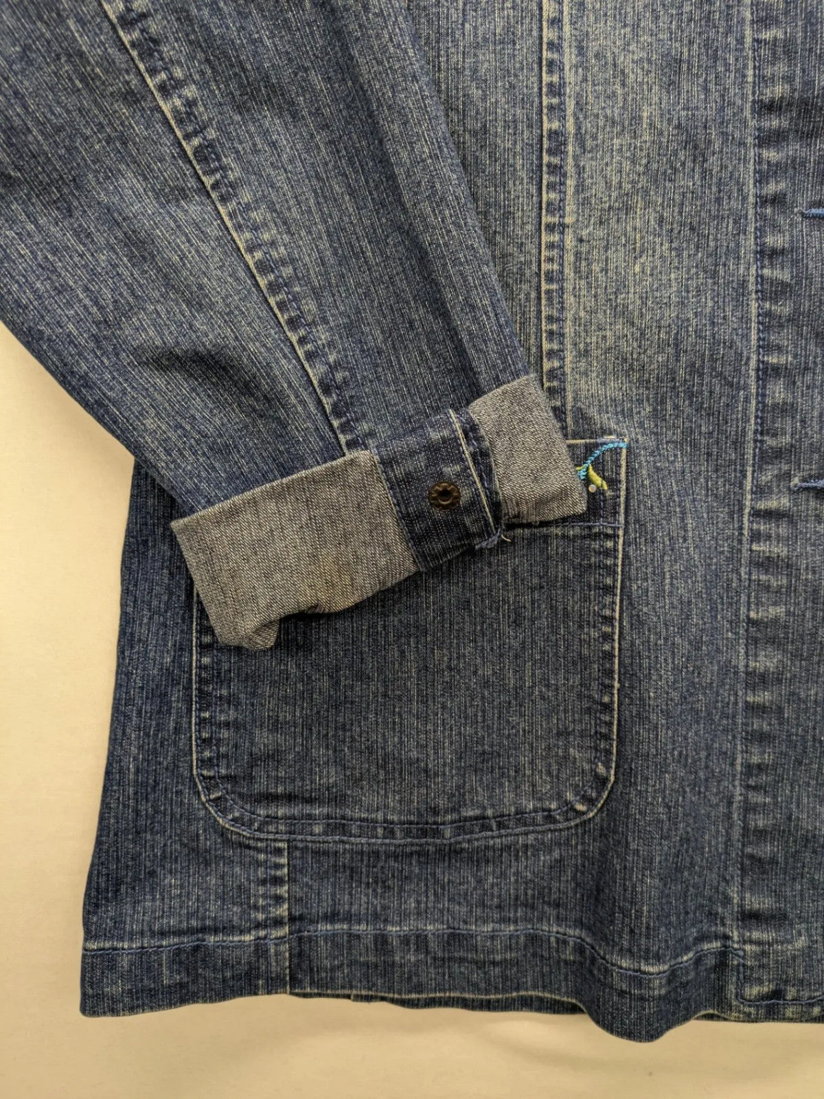 Zala blue denim blazer jacket with embroidered details and classic button closure.
