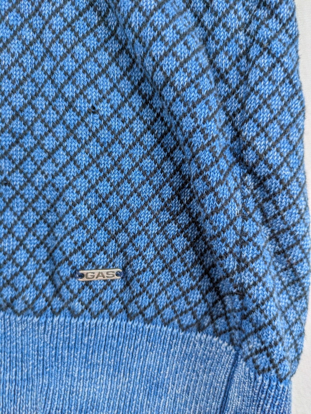 Gas blue turtle neck jumper with diamond pattern, three-button Henley neck, and contrasting trim.
