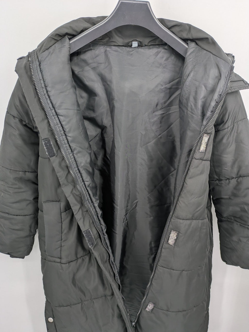 Zeeman grey quilted coat size 38 with hood and side snap buttons.