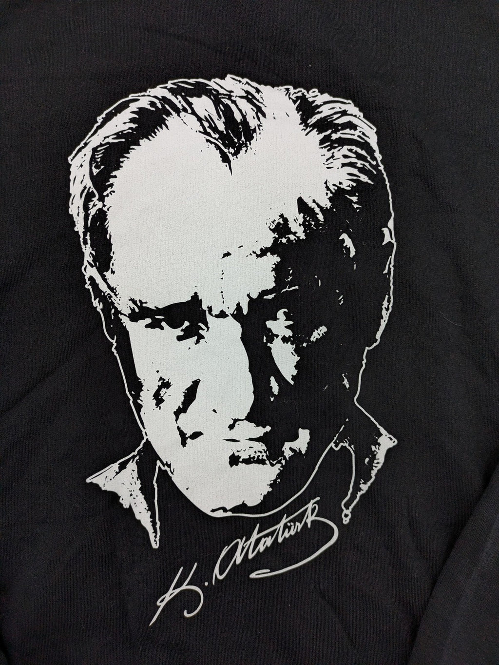 LC Waikiki black turtle neck jumper featuring Atatürk graphic print and signature.