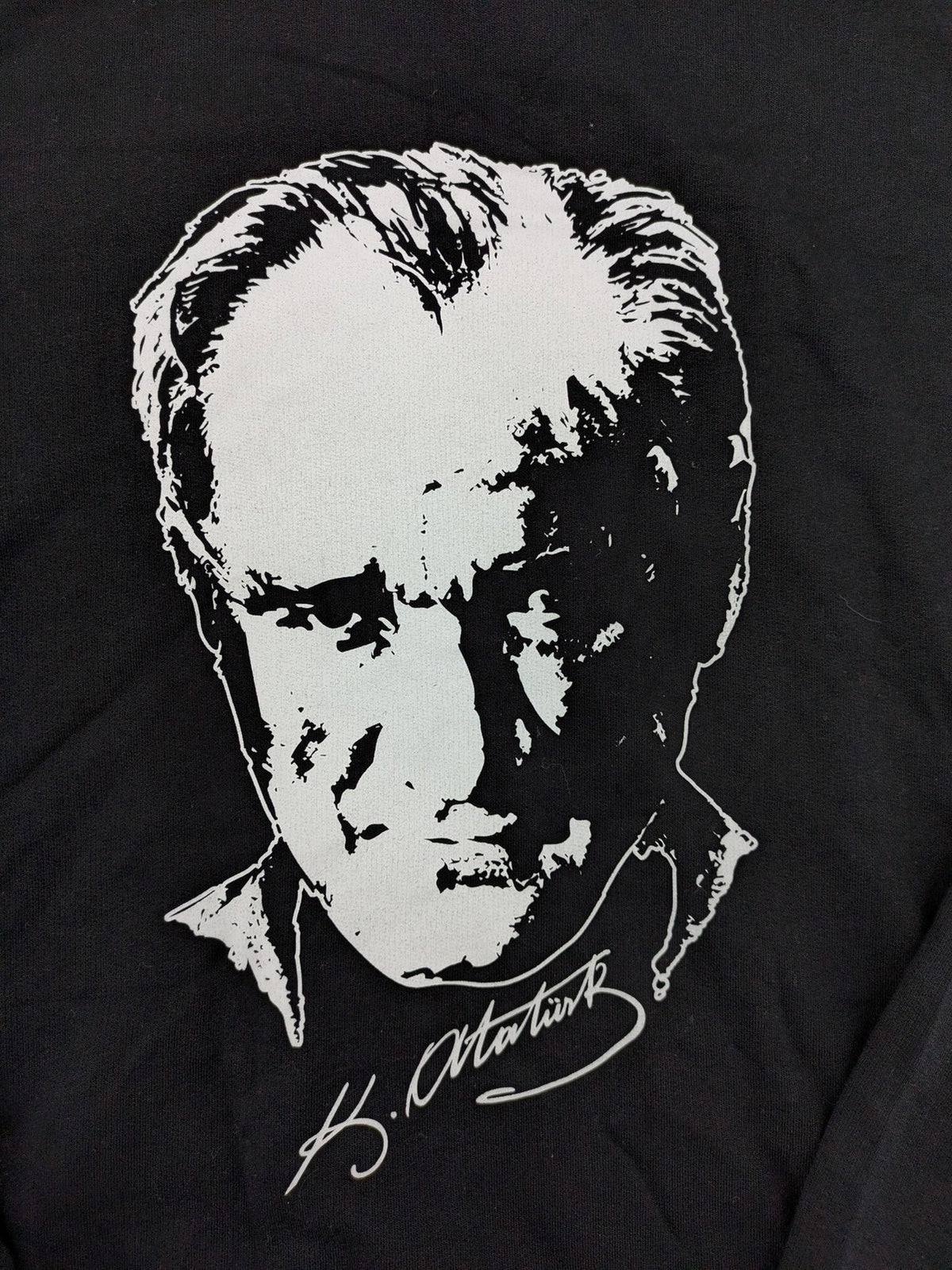 LC Waikiki black turtle neck jumper featuring Atatürk graphic print and signature.