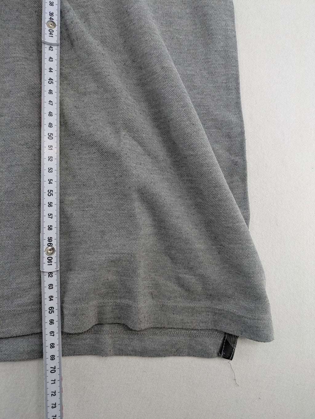 Götter & Helden grey polo shirt with "Gods Favorite" embroidery and contrasting collar details.