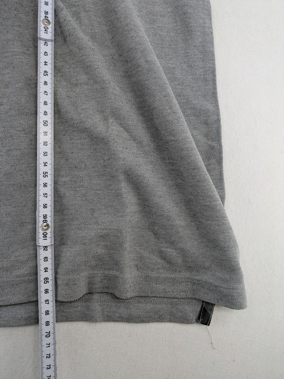 Götter & Helden grey polo shirt with "Gods Favorite" embroidery and contrasting collar details.