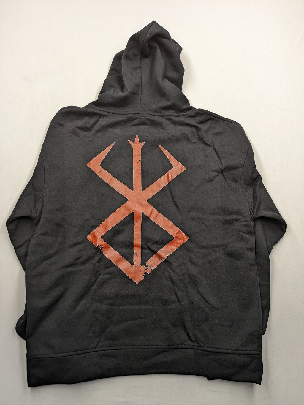 Berserk black hoodie with red Brand of Sacrifice logo and Vegvisir-inspired graphic.