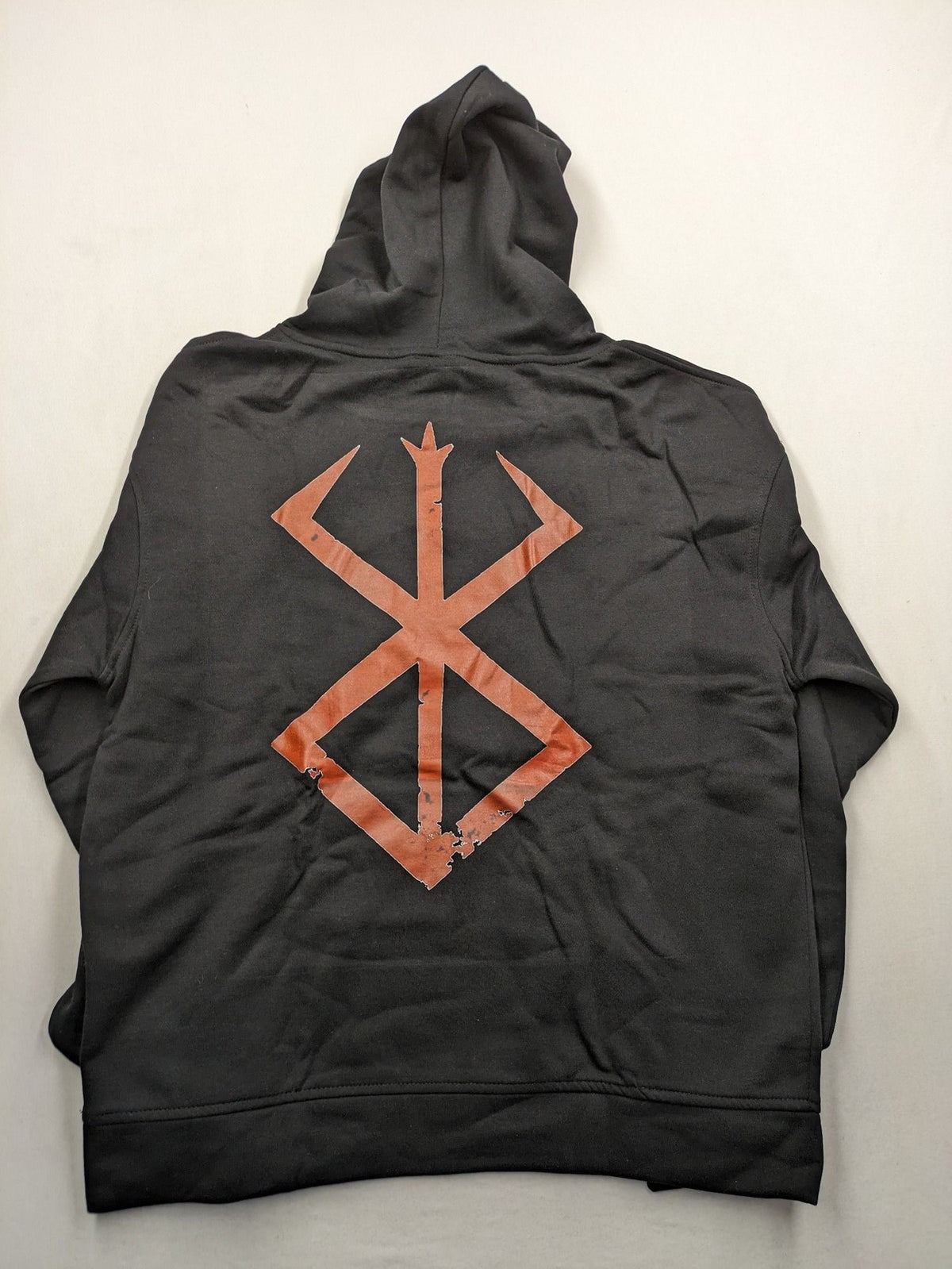 Berserk black hoodie with red Brand of Sacrifice logo and Vegvisir-inspired graphic.