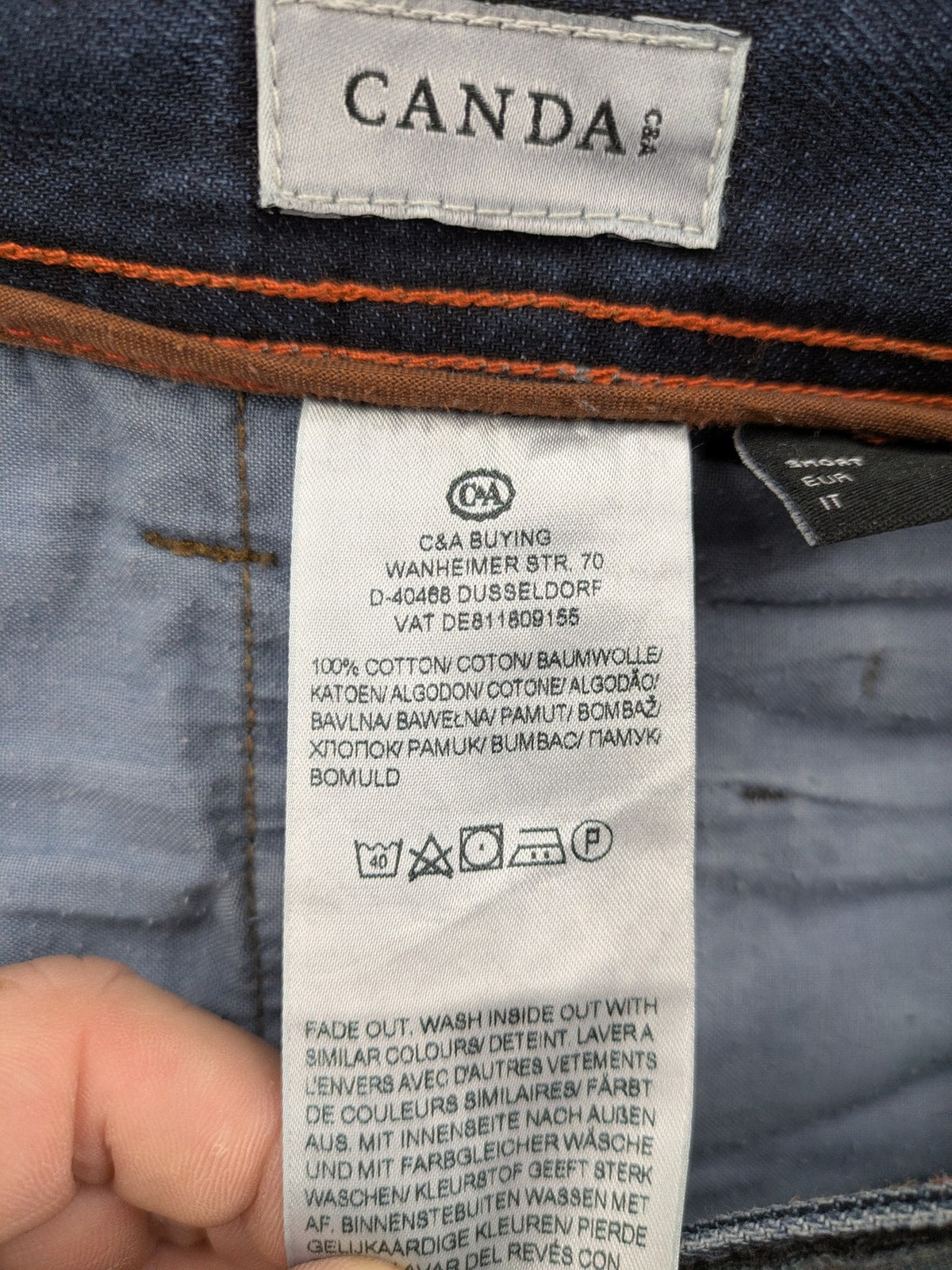 Canda blue straight jeans with five-pocket design and dark wash denim.