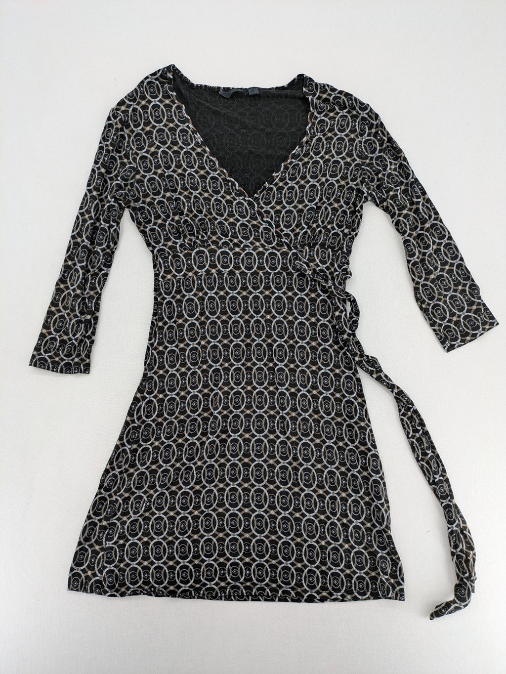 TCM pink wrap dress with V-neck, 3/4 sleeves, geometric black, white, and brown pattern.