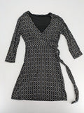 TCM pink wrap dress with V-neck, 3/4 sleeves, geometric black, white, and brown pattern.