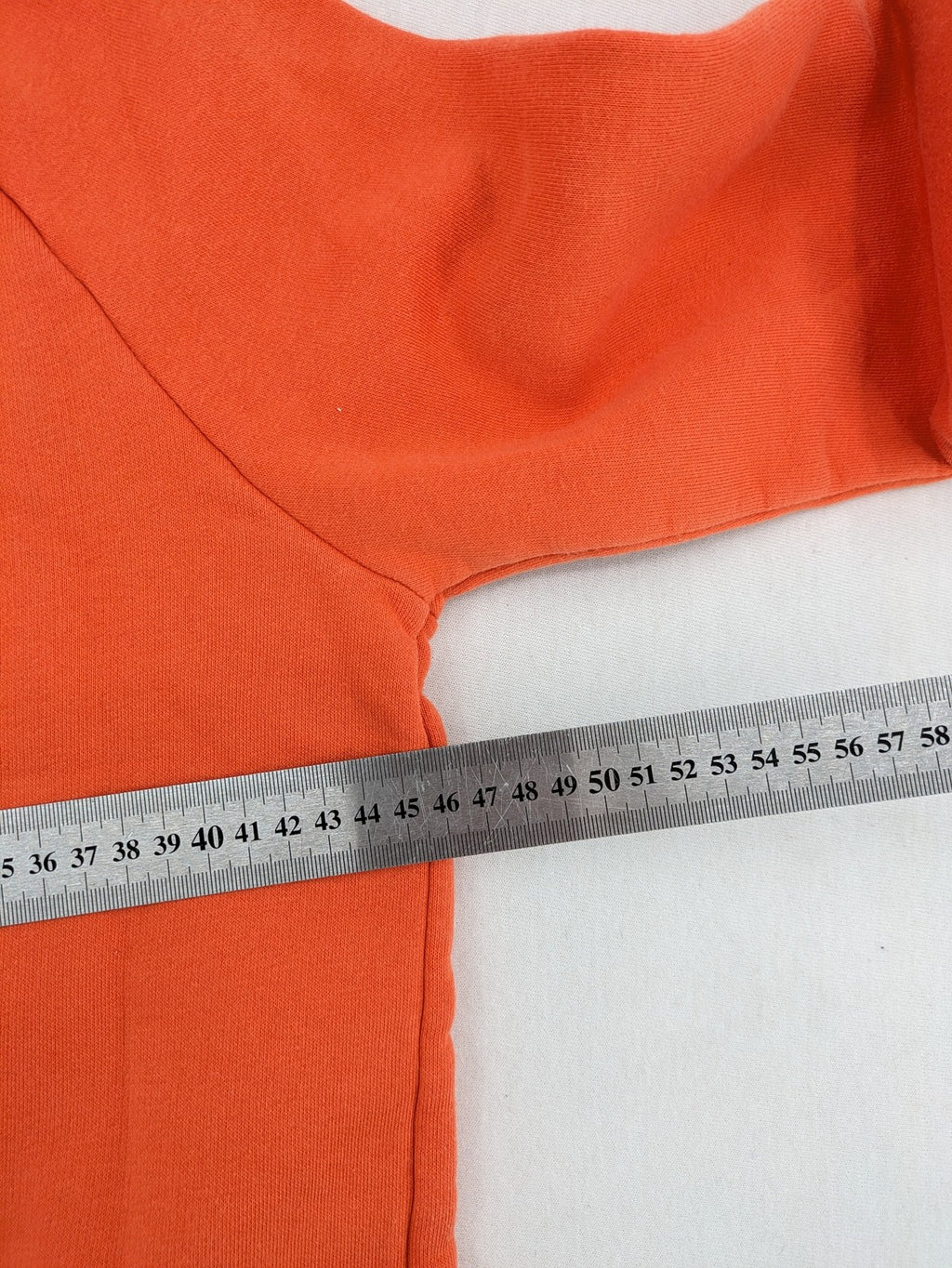 Ginatricot orange hoodie with embroidered winking eye detail, soft material, classic fit.
