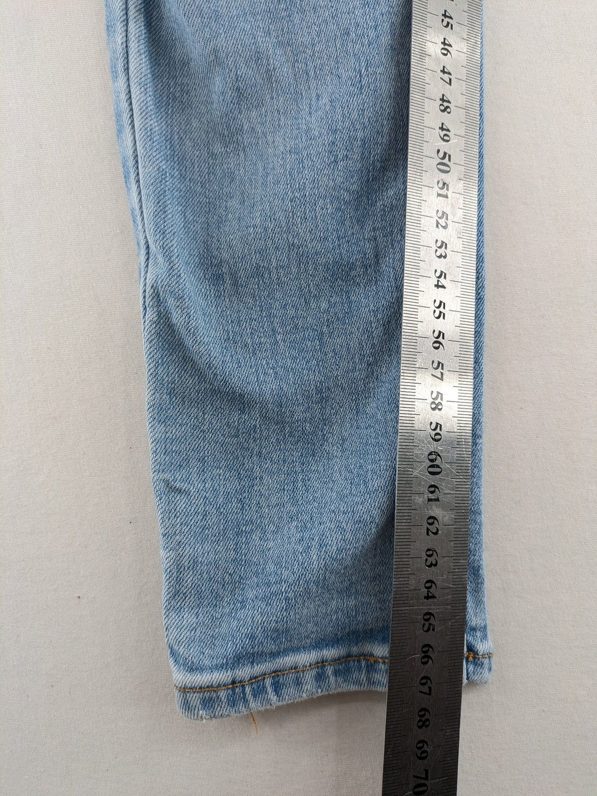 Bershka blue super high waist skinny jeans with washed denim finish and zip closure.