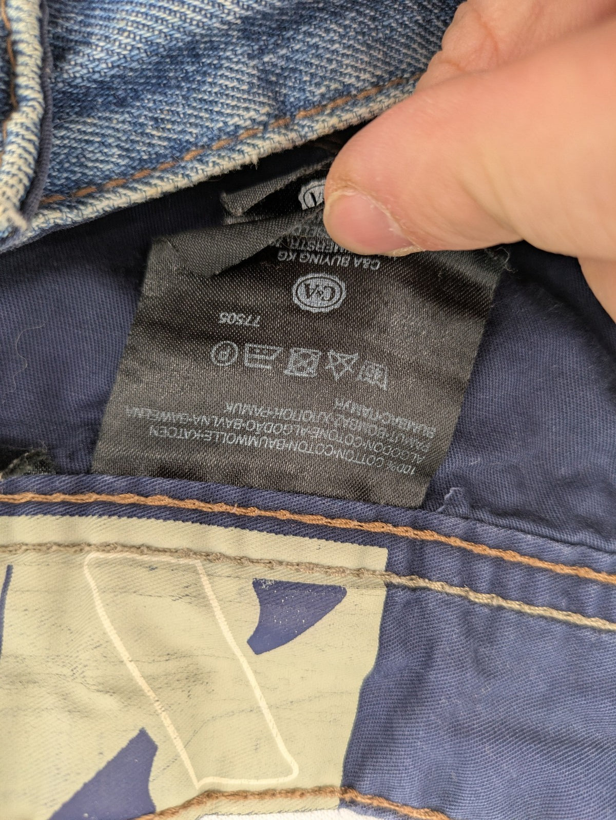 C&A blue straight jeans 5-pocket style with logo and button closure.