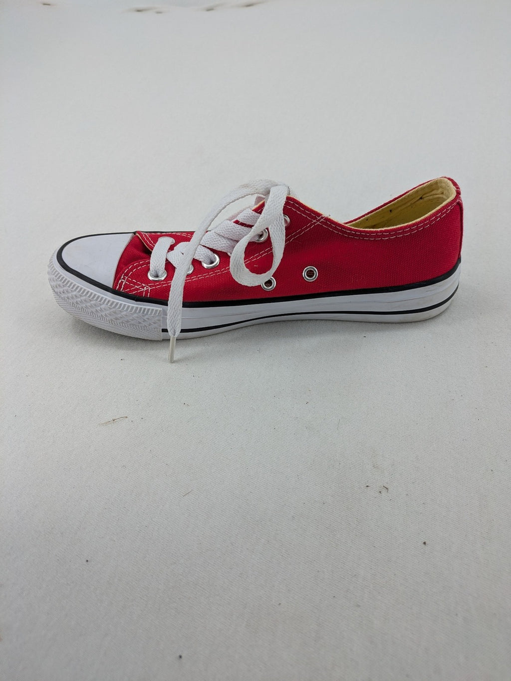 Sneaker low-top canvas sneakers red upper with white laces and rubber sole