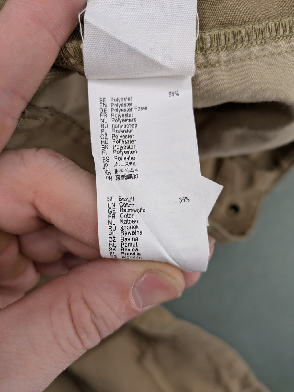 Fjällräven beige pants regular fit durable fabric outdoor style with logo detail.