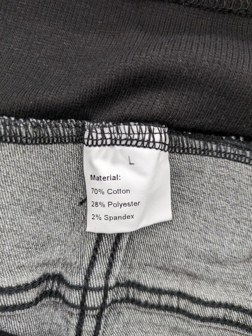 Damen grey maternity pants with black elastic belly band and stretch fabric.