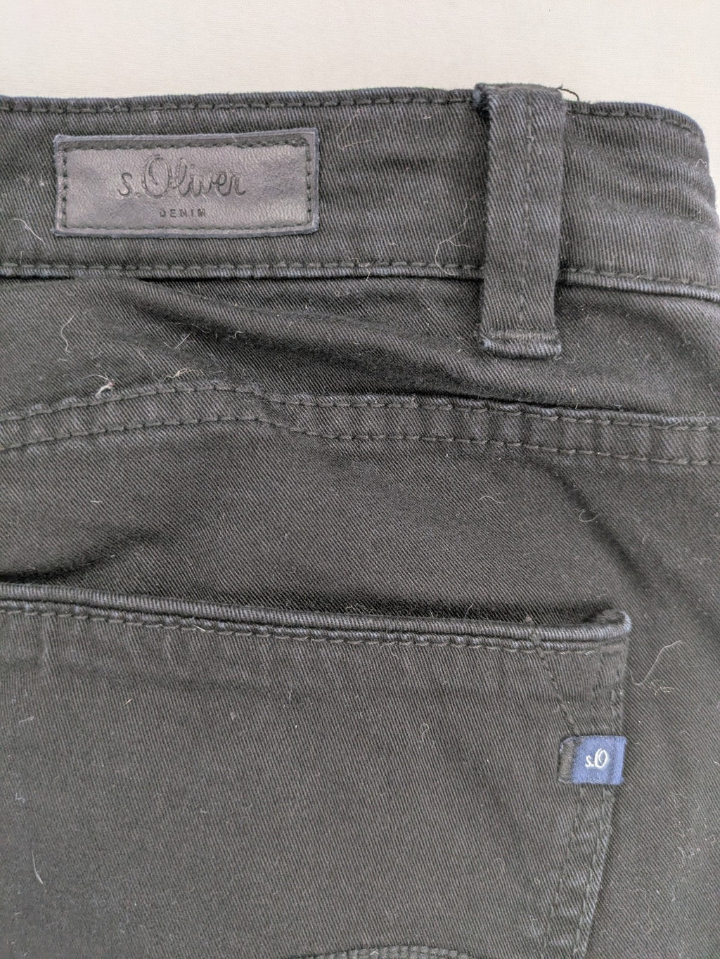 s.Oliver black slim fit jeans with low rise and classic design details.