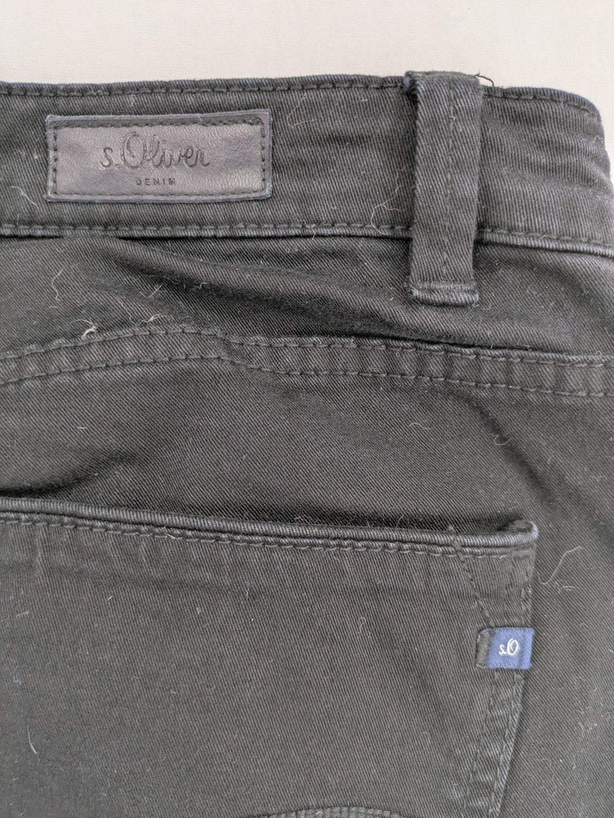 s.Oliver black slim fit jeans with low rise and classic design details.