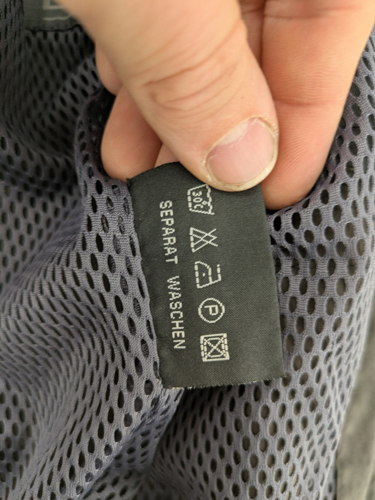 Barisal grey coat with hood, cargo pockets, and checkered lining detail.