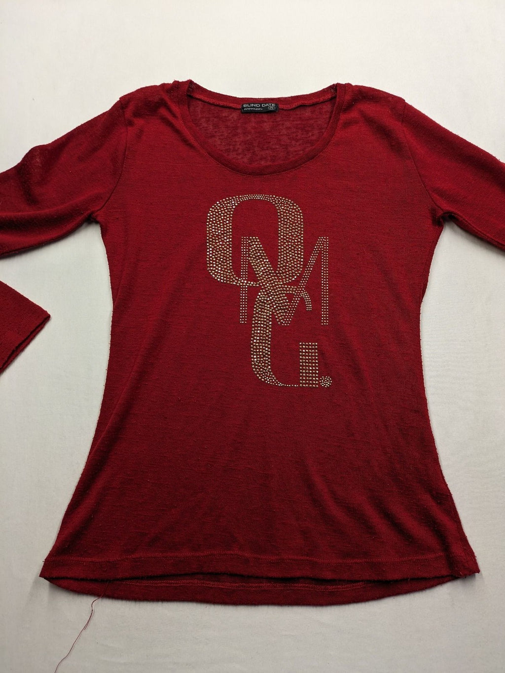 BLIND DATE cream red long sleeve top with sparkling OMG rhinestone design and classic round neckline.