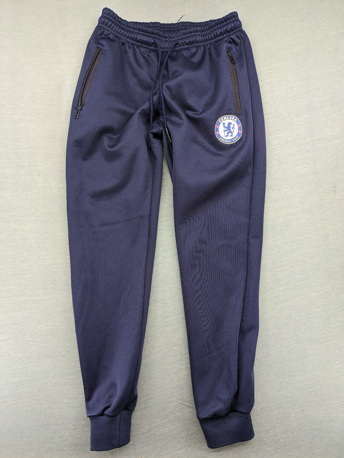 Chelsea FC grey and navy tracksuit set with full zip hoodie and three logos.