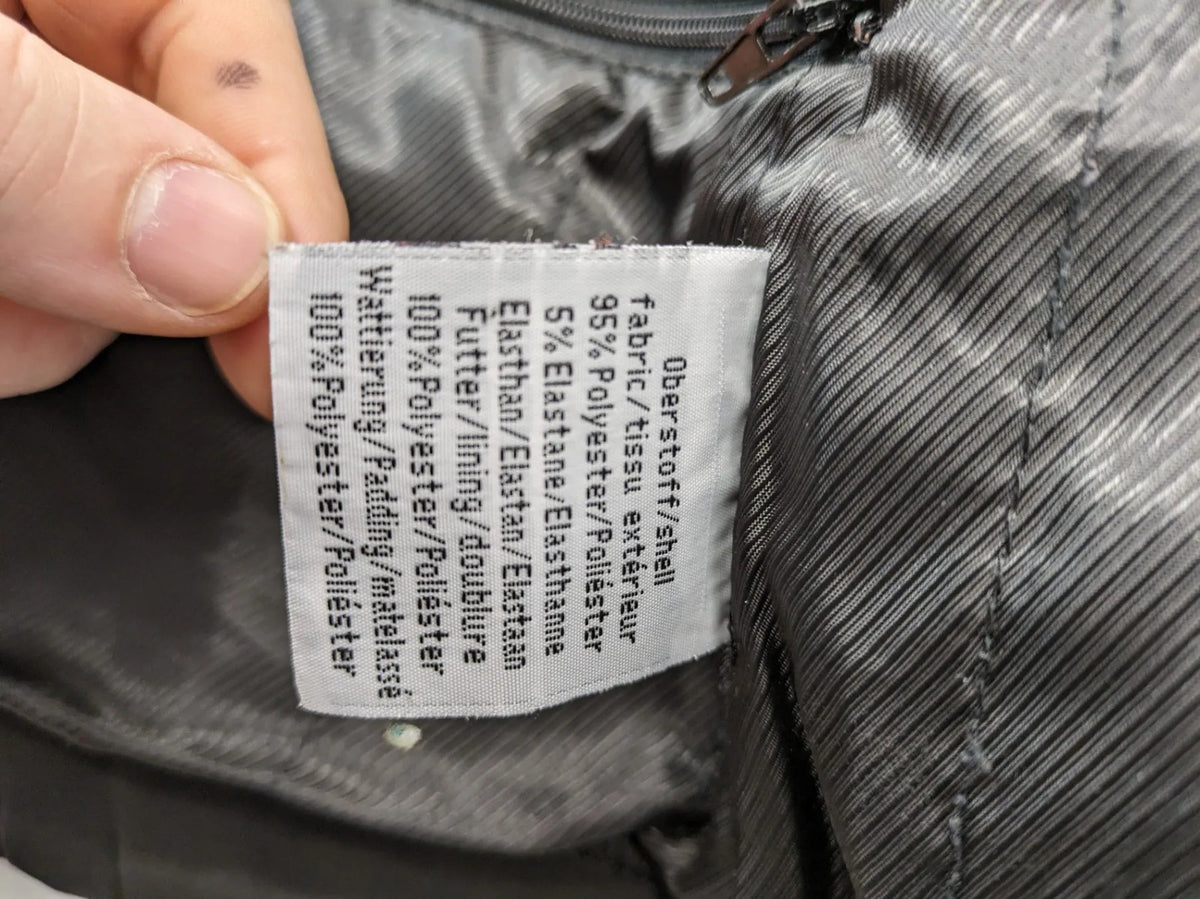 James & Nicholson grey softshell jacket with fleece lining and multiple zip pockets.