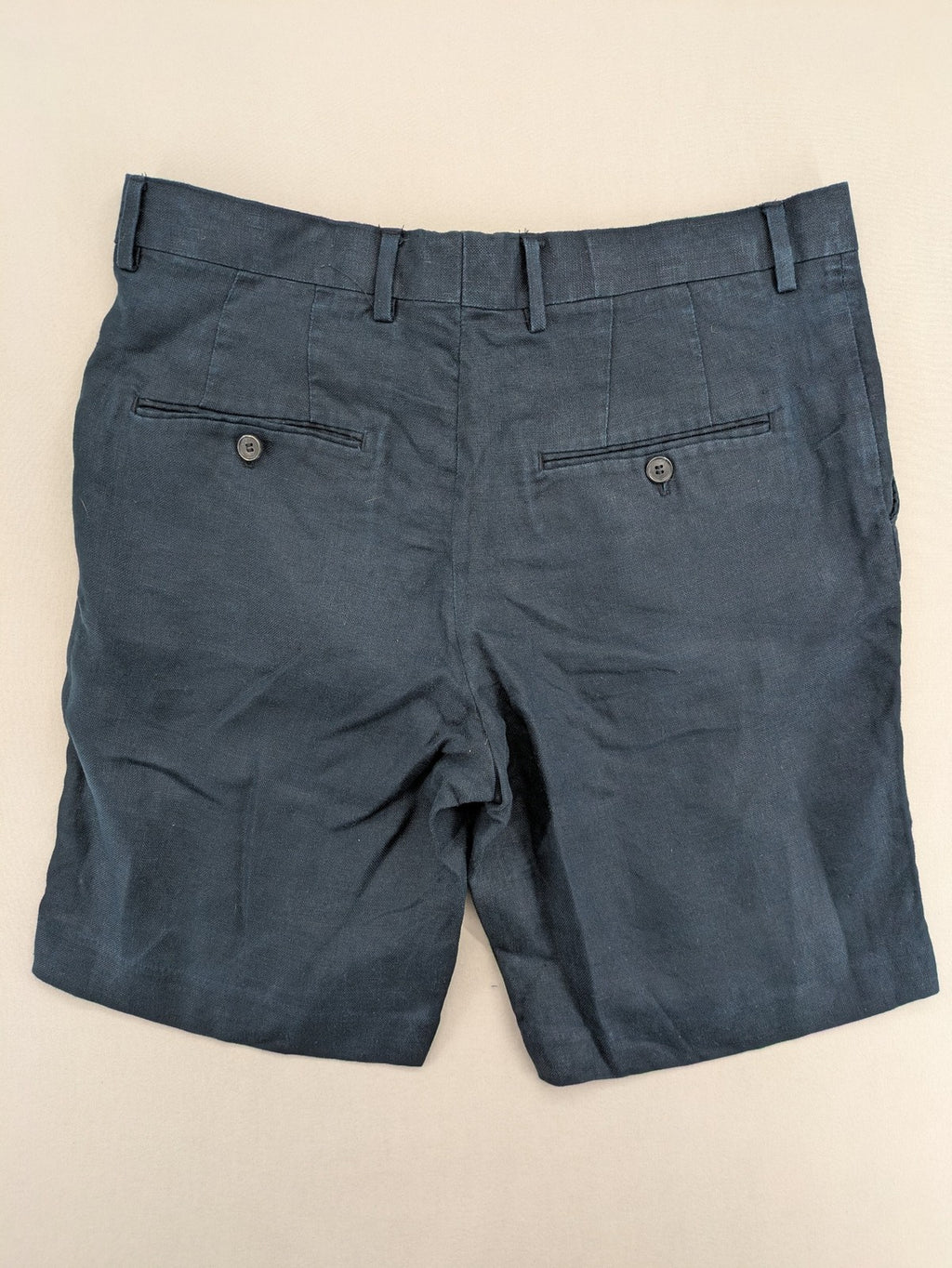 H&M blue linen shorts size 50 flat front design with practical pockets.