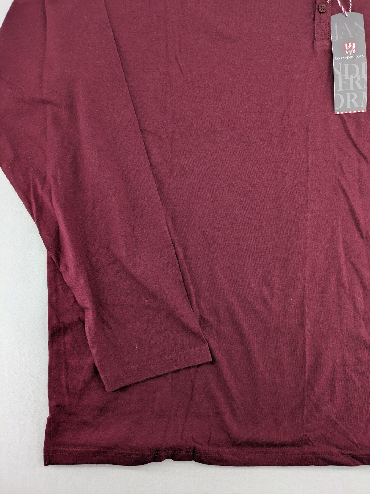 Jan Vanderstorm burgundy Henley shirt with button placket and "087 JV DEPT" graphic print.