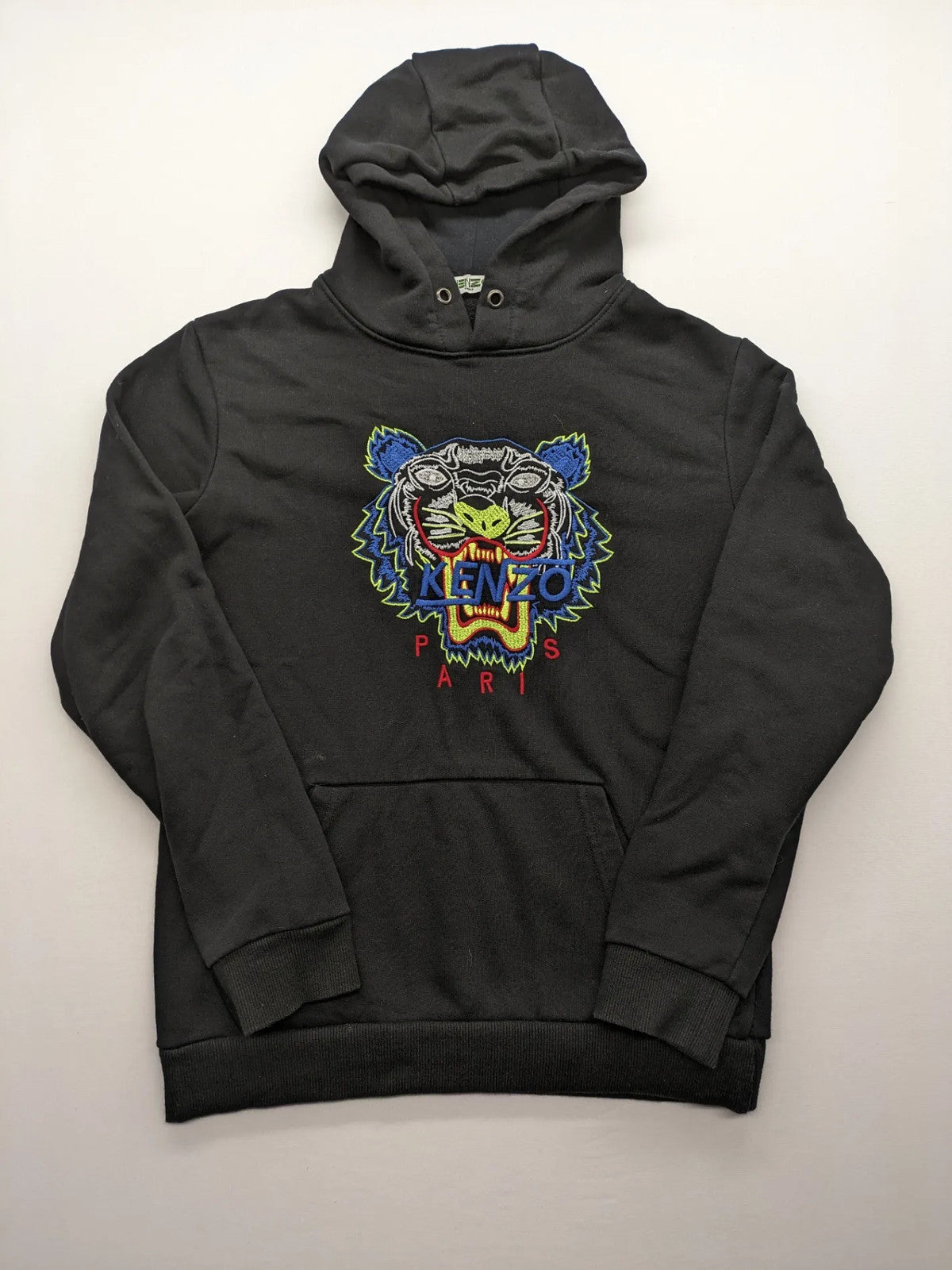 Kenzo multi hoodie with embroidered tiger graphic, drawstring hood, and kangaroo pocket.