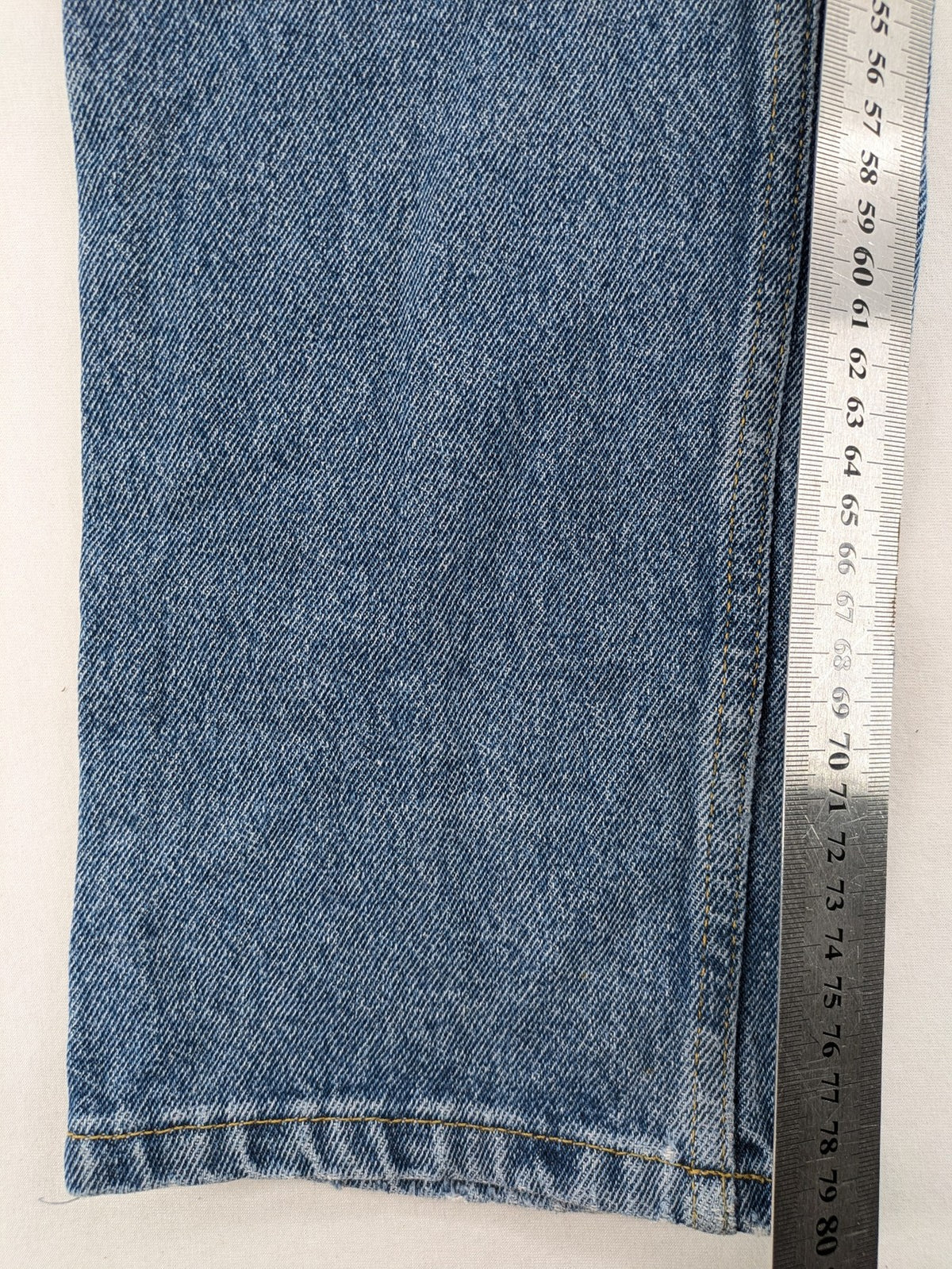 Castro Jeans blue straight leg jeans high waist with white paint splatter details.